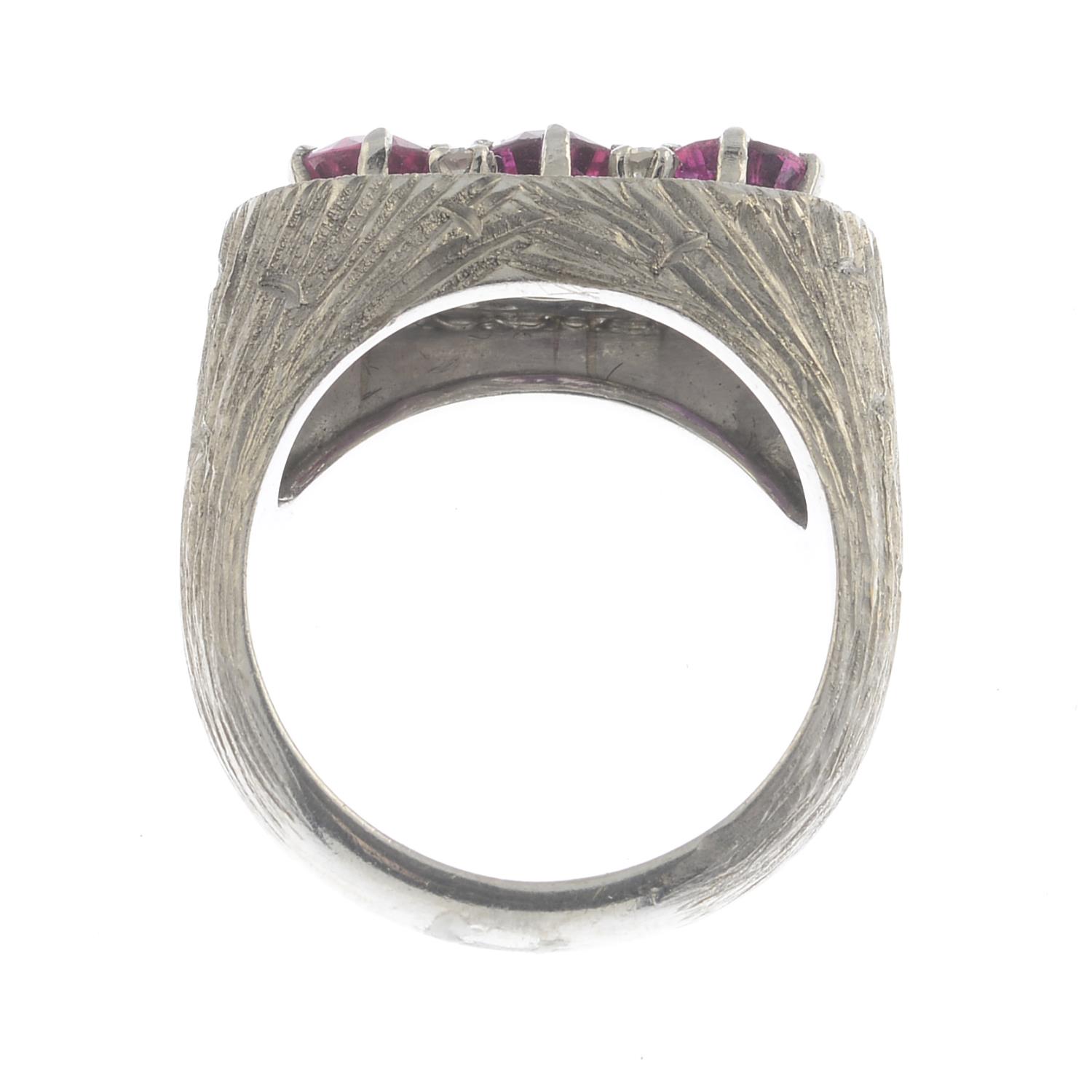 A mid 20th century gold ruby three-stone and diamond cluster ring.Estimated total diamond weight - Image 3 of 3