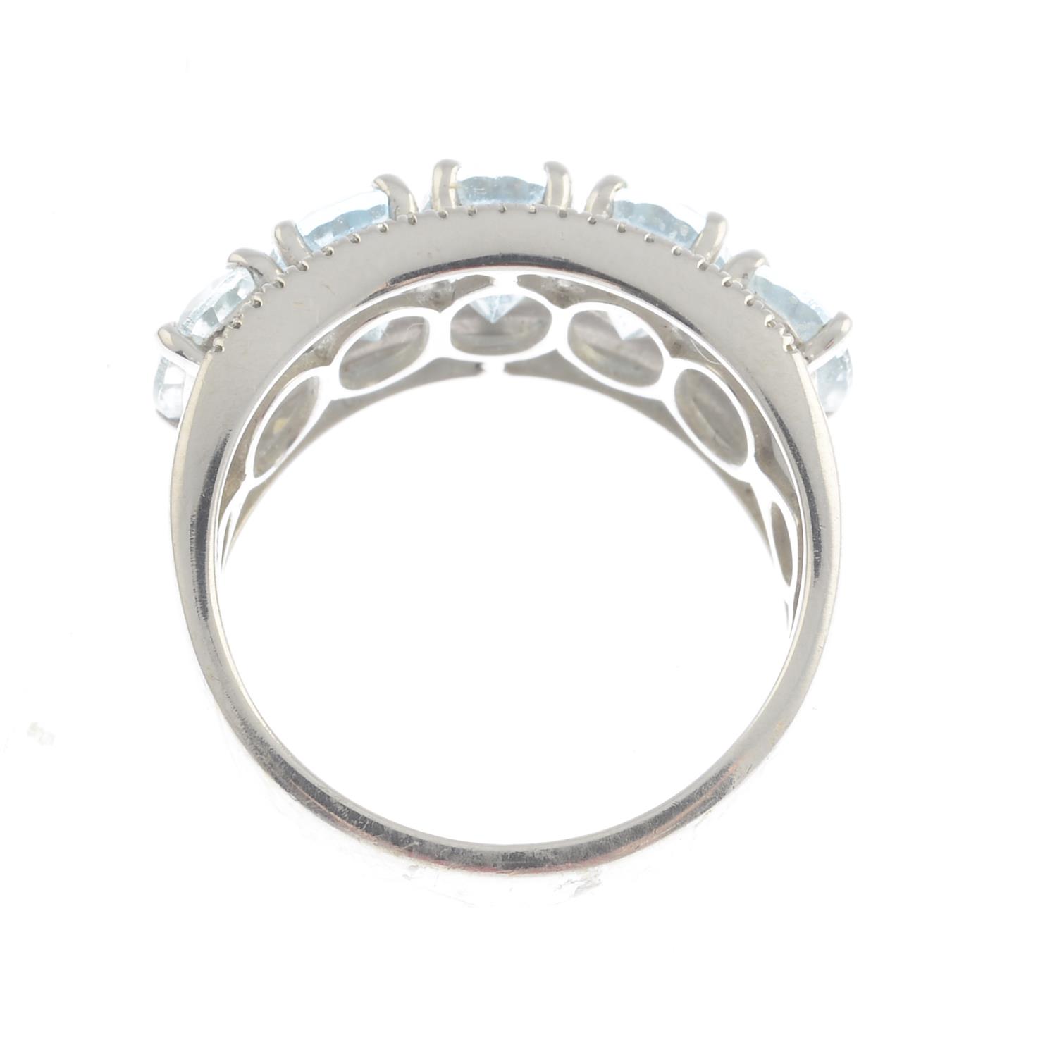 An aquamarine and diamond dress ring.Approximate dimensions of central aquamarine 7 by 5 by - Image 3 of 3