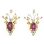 A pair of diamond and garnet earrings.Total diamond weight 0.69ct,