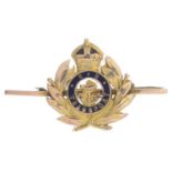 An early 20th century gold and enamel Royal Navy, transport regiment brooch.Length 4.3cms.