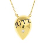 An 18ct gold diamond and blue enamel 'Ritz' pendant,