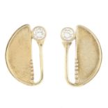 A pair of diamond earrings.Estimated total diamond weight 0.30ct,