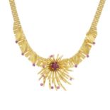 A 1960's 9ct gold necklace, with floral spray and ruby highlights.