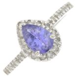 A tanzanite and diamond cluster ring.Estimated total diamond weight 0.20ct.Stamped 14k.