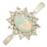 An 18ct gold opal and diamond cluster ring.Approximate opal dimensions 7.1 by 5.8 by 2.4mms.