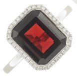 An 18ct gold garnet and diamond dress ring.Garnet calculated weight 4cts,