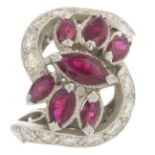 A ruby and diamond dress ring.Estimated total diamond weight 1ct.Ring size M.