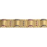 A 1960's 9ct gold ruby and sapphire bracelet.Hallmarks for London, 1961.Length 16.6cms.