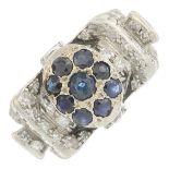 A sapphire and diamond dress ring.Estimated total diamond weight 0.90ct.Ring size K1/2.