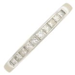 A platinum diamond half eternity ring.