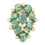An emerald cabochon and diamond cluster pendant.
