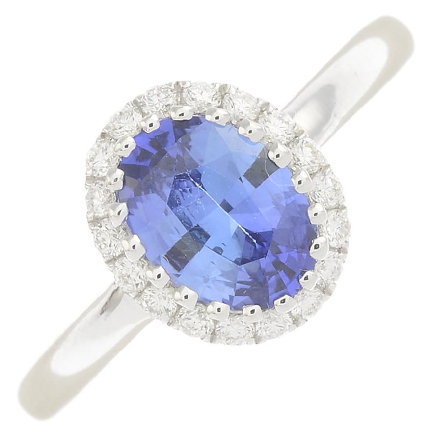 A sapphire and diamond dress ring.Sapphire weight 0.99ct,