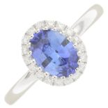 A sapphire and diamond dress ring.Sapphire weight 0.99ct,
