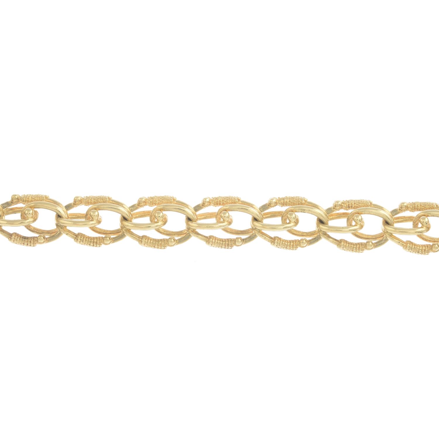 A fancy-link bracelet.Stamped 10k.Length 20.4cms.