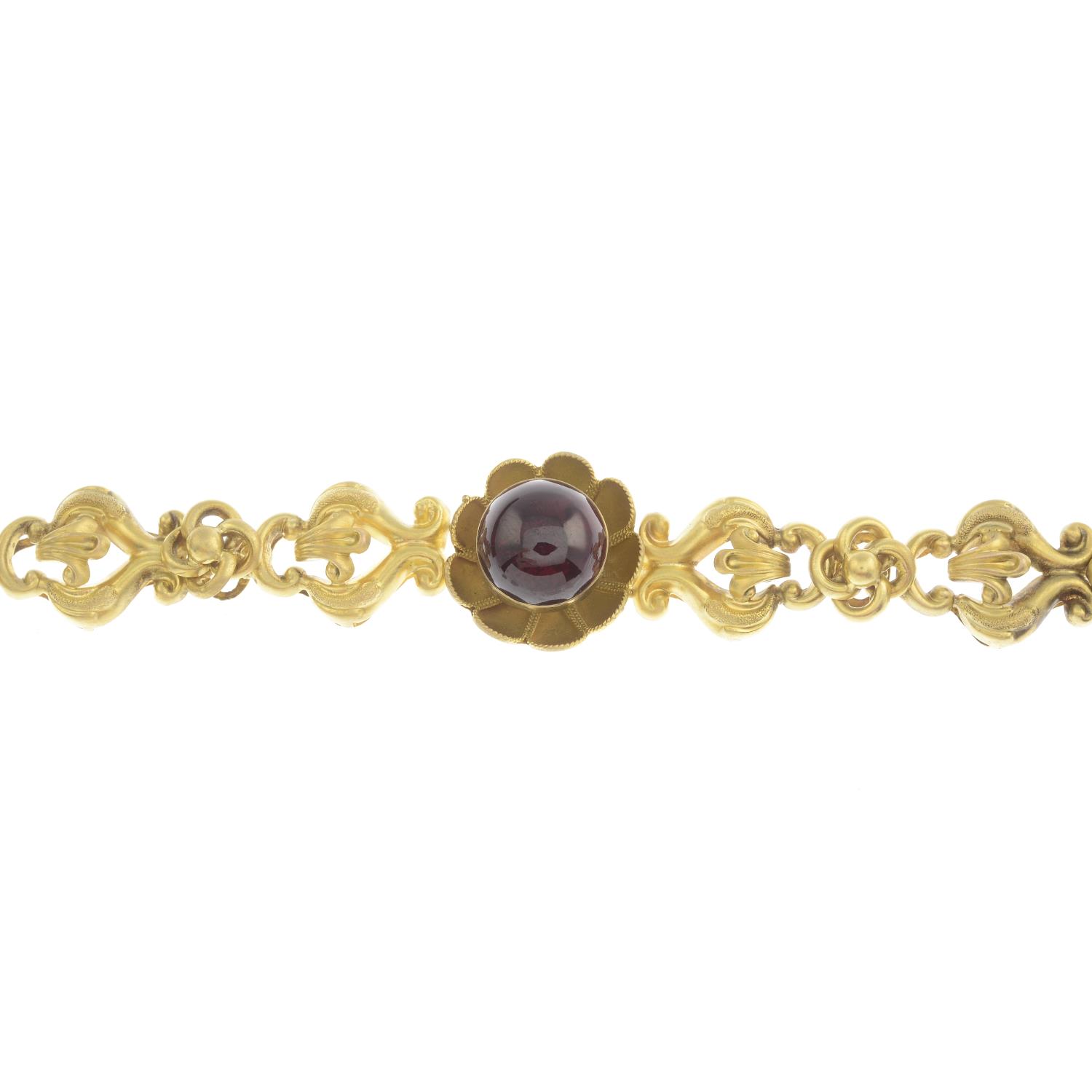 A garnet floral and scrolling foliate bracelet.Length 15cms.