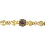 A garnet floral and scrolling foliate bracelet.Length 15cms.