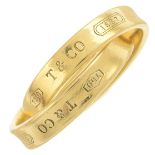 An '1837' interlocking ring, by Tiffany & Co.Signed Tiffany & Co.Stamped 750.Ring size I1/2.