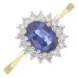 An 18ct gold sapphire and diamond cluster ring.Calculated sapphire weight 0.80ct,