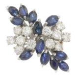 An 18ct gold sapphire and diamond dress ring.Estimated total diamond weight 1.20cts,