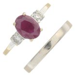 An 18ct gold ruby and diamond three-stone ring and a band ring.Ruby calculated weight 0.87ct,