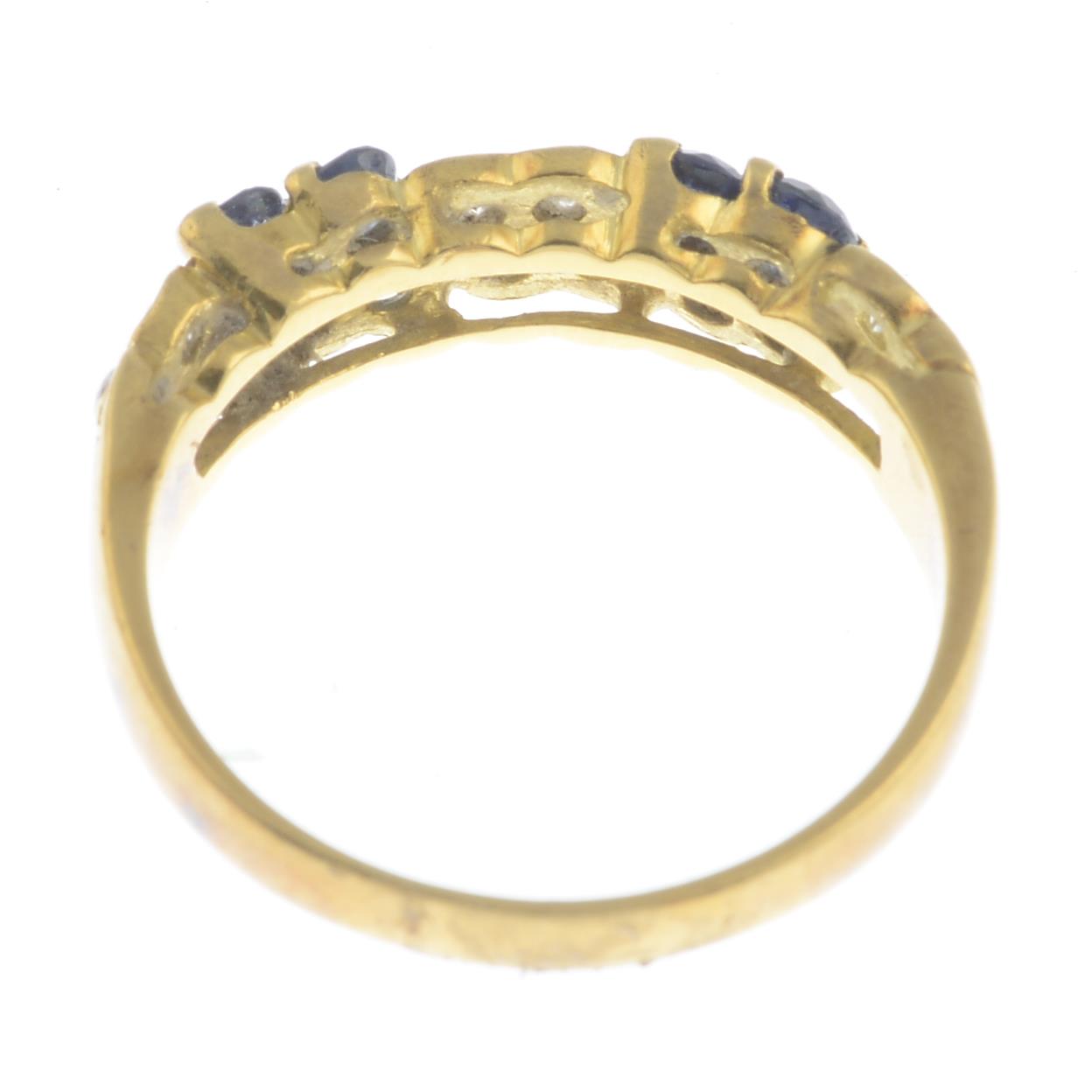 An 18ct gold sapphire and diamond dress ring.Estimated total diamond weight 0.25ct.Hallmarks for - Image 2 of 3