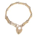 A gate bracelet, with heart-shape padlock clasp.Clasp stamped 9ct.