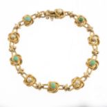 An early 20th century 15ct gold turquoise and split pearl bracelet.Stamped 15ct.Length 18.6cms.