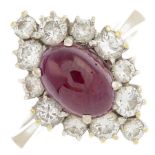 A ruby and diamond cluster ring.Ruby calculated weight 2.60cts,