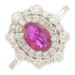 An 18ct ruby and diamond cluster ring.Ruby calculated weight 0.88ct,