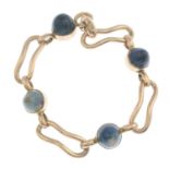 A blue jasper cabochon bracelet.Stamped 9CT.Length 18cms.