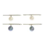 A gentleman's cultured pearl dress stud set, to include two pairs of studs.Length 2.6cms.