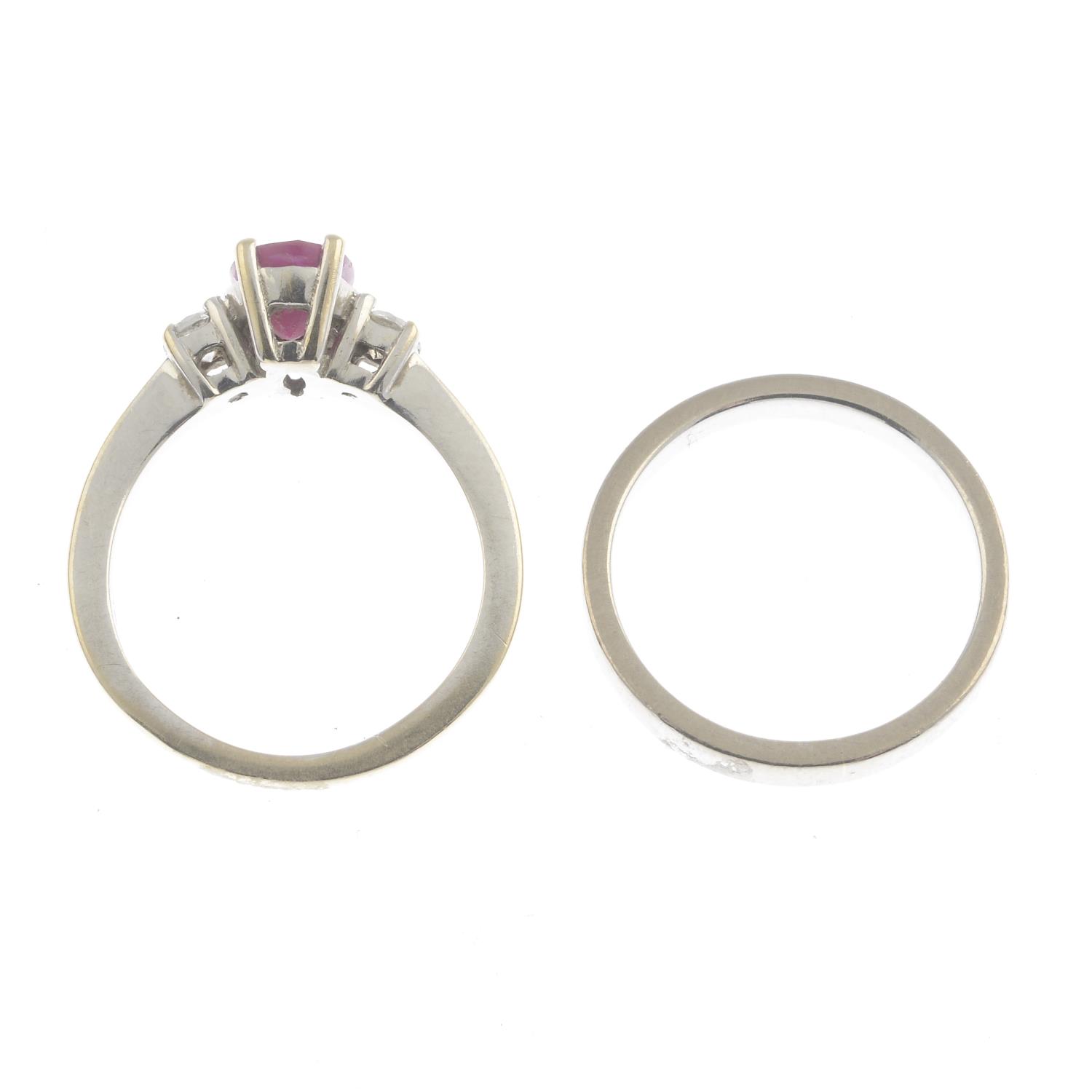 An 18ct gold ruby and diamond three-stone ring and a band ring.Ruby calculated weight 0.87ct, - Image 3 of 3