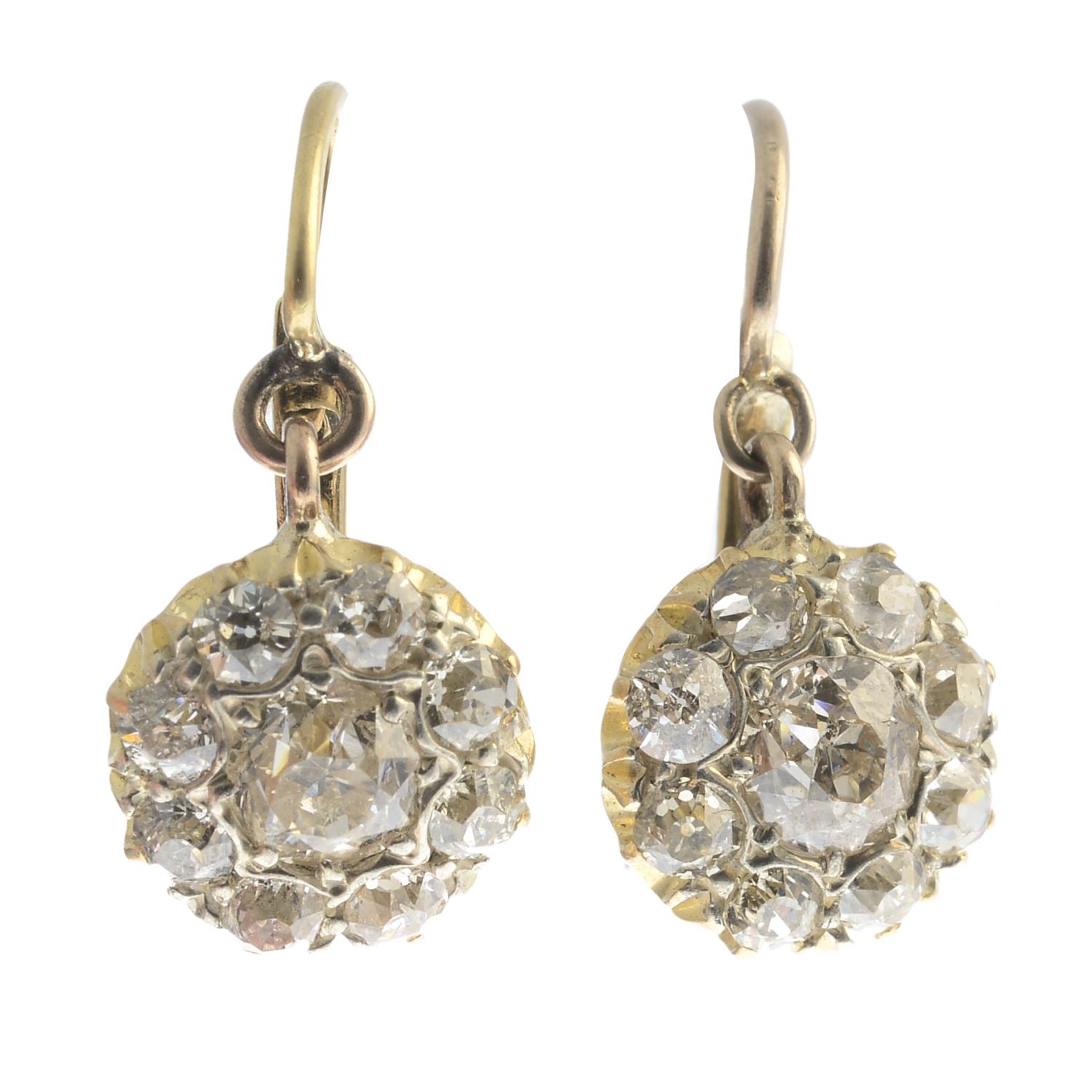 A pair of old-cut diamond cluster earrings.