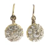 A pair of old-cut diamond cluster earrings.