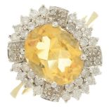 An 18ct gold citrine and vari-cut diamond cluster ring.Citrine calculated weight 2.50cts,