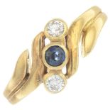 An 18ct gold sapphire and diamond three-stone ring.Estimated total diamond weight 0.15ct.Hallmarks