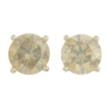 A pair of brilliant-cut 'greenish brown' diamond stud earrings,