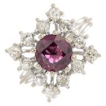 A garnet and diamond cluster ring.Garnet calculated weight 1.98cts based on estimated dimensions of