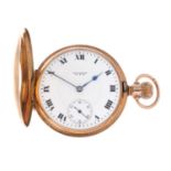 A half hunter pocket watch by Waltham.