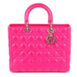 CHRISTIAN DIOR - a fuchsia pink leather Cannage Lady Dior GM handbag.