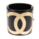 CHANEL - a black Resin CC Cuff bracelet.