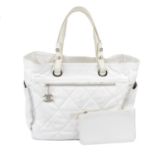 CHANEL - a white Paris Biarritz GM shopper handbag.