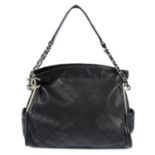 CHANEL - a black quilted leather handbag.