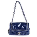 CHANEL - a small Luxe Ligne Flap handbag.