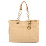 CHRISTIAN DIOR - a beige Cannage handbag.