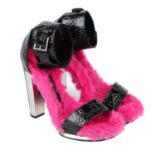 ALEXANDER MCQUEEN - a pair of fur lined platform sandals.