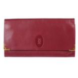 CARTIER - a Bordeaux leather travel wallet.