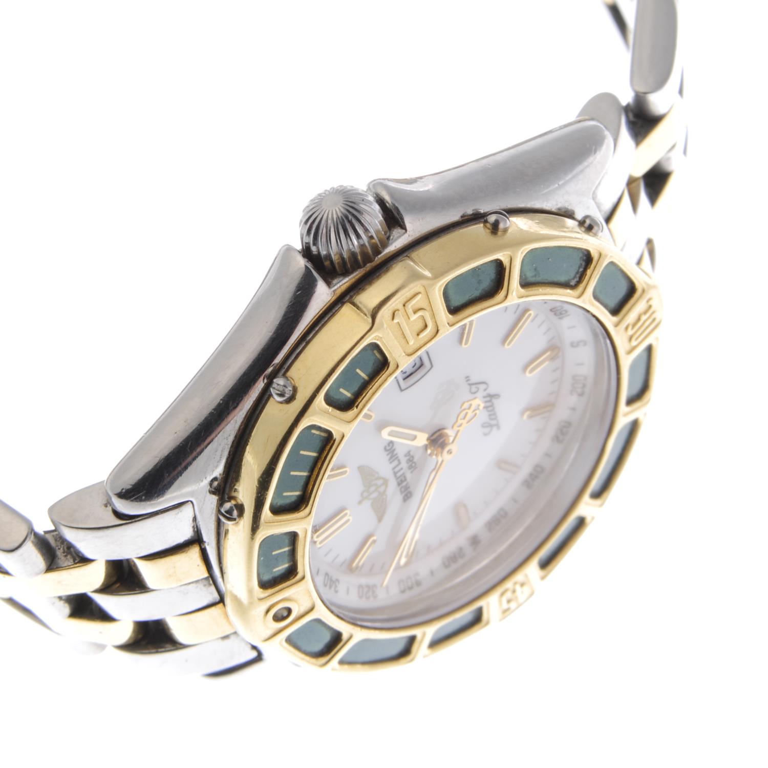 BREITLING - a lady's Lady J bracelet watch. Stainless steel case with yellow metal calibrated bezel. - Image 4 of 5