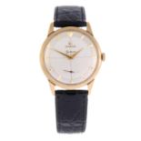 OMEGA - a gentleman's Genève wrist watch. 9ct yellow gold case, hallmarked Birmingham 1959. Numbered