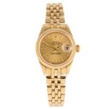 ROLEX - a lady's Oyster Perpetual Datejust bracelet watch. Circa 1996. 18ct yellow gold case with